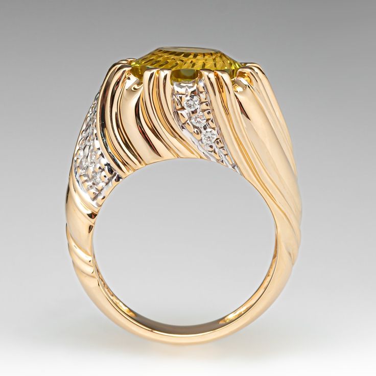 This uniquely beautiful ring is centered with one (1) round fantasy cut natural citrine set into an eight- split prong setting. The ring is also accented with twenty-six (26) bead set, round brilliant cut diamonds. The ring measures 13.8mm at the top, rises 9.6mm above the finger, tapering to 4.7mm wide and 1.5mm thick at the base of the shank. It is currently a size 7. The citrine has a few corner nicks that are hidden by the prongs and don't take away from this spectacular stone. Luxury Brilliant Cut Citrine Diamond Ring, Luxury Citrine Topaz Ring With Gemstone Accents, Luxury Citrine Diamond Ring With Prong Setting, Luxury Yellow Topaz Ring With Diamond Accents, Formal Yellow Topaz Ring With Diamond Accents, Formal Citrine Ring With Diamond Accents, Luxury Diamond Ring With Gemstone Accents, Luxury Diamond Ring With Gemstone Accents, Round Cut, Elegant Yellow Sapphire Topaz Ring With Accent Stones