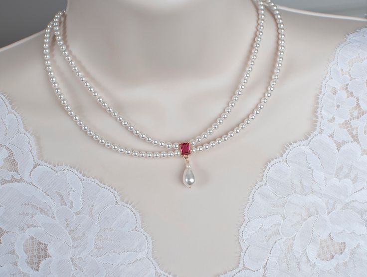 Vintage, Romantic Style Ruby Necklace, Wedding Pearl and Ruby CZ Bridal Choker, Ruby CZ Multi Row Vintage Swarovski Pearl Necklace Materials used: - White/Ivory Cream Swarovski pearls - cubic zirconia stones - gold plated over brass The necklace will arrive packaged ready for gift giving in a delicate white jewelry box with a silver ribbon. Matching earrings for this necklace:  Back to my shop http://www.etsy.com/shop/crinadesign73 Thank you for visiting my store! Swarovski Pearl Necklace, Bridal Choker, Silver Ribbon, Simple Pearl, White Jewelry Box, Ruby Necklace, Necklace Wedding, White Jewelry, Pearl Wedding