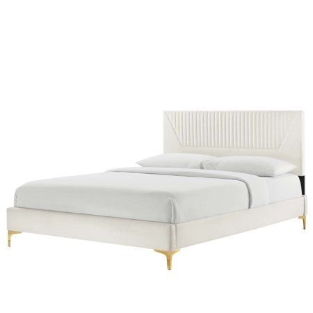 a white bed with gold legs and headboard on it's side, against a white background