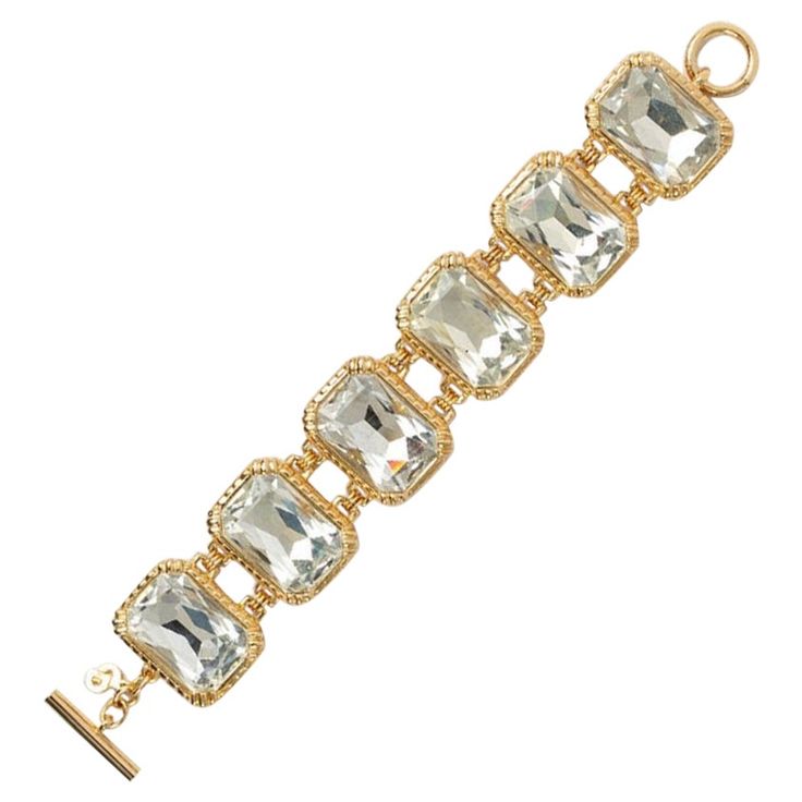 Dior -Articulated bracelet in gold metal and rhinestones. To note, a scratch on the back of a visible rhinestone. Additional information: Dimensions: Length: 21 cm Width: 3 cm Condition: Very good condition Seller Ref number: BRA38 Luxury Jeweled Crystal Bracelets, Luxury Rhinestone Crystal Bracelet, Gold Crystal Bracelets With Jewels, Luxury Metal Bracelets With Sparkling Stones, Luxury Metal Bracelet With Sparkling Stones, Luxury Gold Crystal Bracelets, Formal Jeweled Crystal Bracelets, Luxury Gold Crystal Bracelet With Sparkling Stones, Elegant Metal Diamond Bracelet With Rhinestones