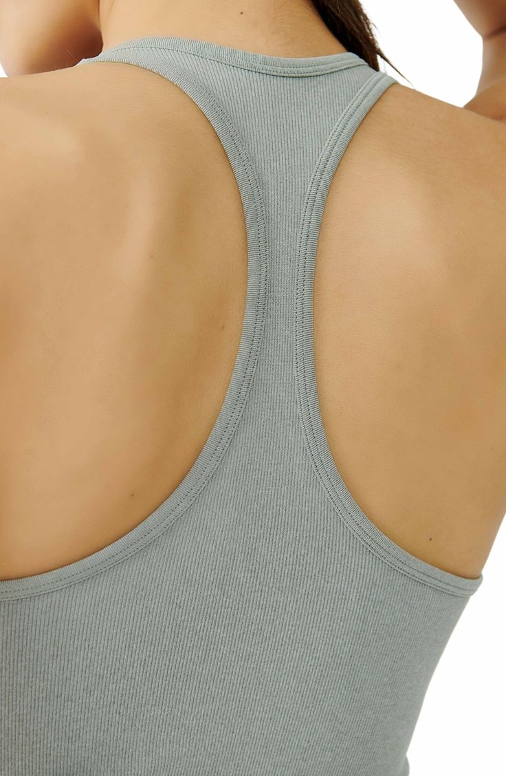 Lounge or layer in this oh-so-versatile ribbed crop top that looks (and feels) great wherever you go. 17" length (size Medium/Large) Crewneck Sleeveless Racerback 92% nylon, 8% spandex Machine wash, dry flat Imported Casual Ribbed Scoop Neck Sports Bra, Athleisure Scoop Neck Crop Top With Seamless Construction, Ribbed Racerback Crop Top, Athleisure Scoop Neck Seamless Crop Top, Athleisure Crop Top With Seamless Construction And Scoop Neck, Seamless Scoop Neck Crop Top For Gym, Solid Ribbed Cropped Top, Ribbed Scoop Neck Sports Bra In Athleisure Style, Spring Scoop Neck Gym Crop Top