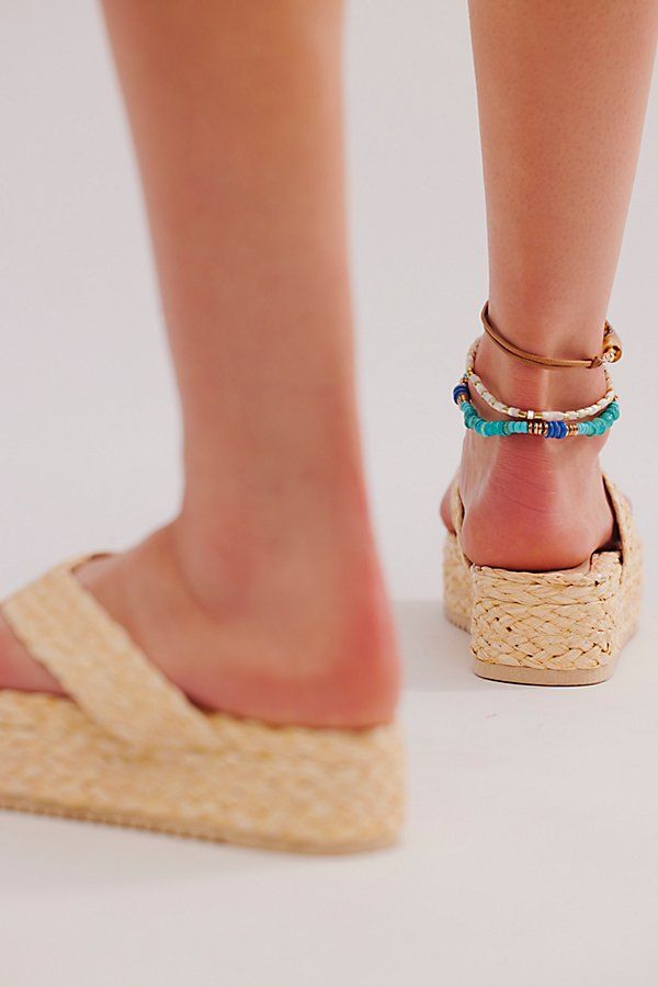 An attitude-packed summer style gets a beachy twist with these braided sandals from Matisse, featured in a flatform style with woven raffia uppers for a breezy touch. **Features:** Slip-on style, backless design, woven raffia uppers, thong straps, flatform sole **Why We | Sailor Thong Sandals by Matisse at Free People in Tan, Size: US 11 Summer Beach Espadrilles, Spring Beach Sandals With Woven Sole, Summer Sandals With Braided Straw Straps, Summer Sandals With Woven Sole, Trendy Sandals With Woven Sole For Beach Season, Summer Vacation Sandals With Wedge Heel, Trendy Straw Sandals For Summer, Trendy Straw Espadrilles For Summer, Trendy Summer Straw Sandals