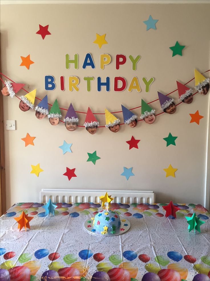 a birthday cake on a table with colorful decorations