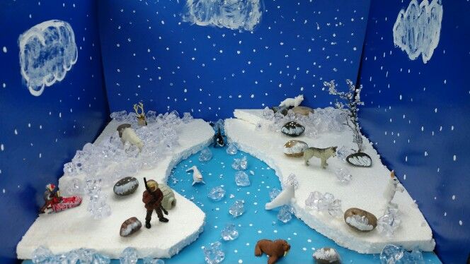 an ice age scene with people and animals on the ice floese, in front of a blue background