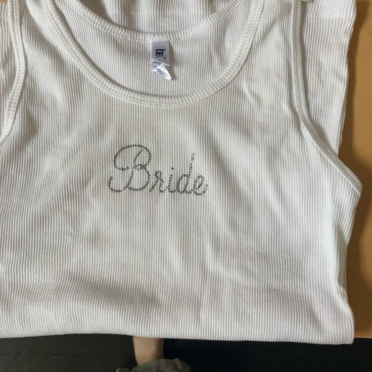 Nwt. Bride Tank With Bride Spelled Out Of Rhinestones. New With Tags. Says Extra Large But Runs Small Bella Canvas, Extra Large, Color White, Womens Tops, Tank Tops, Tags, Canvas, Women Shopping, White