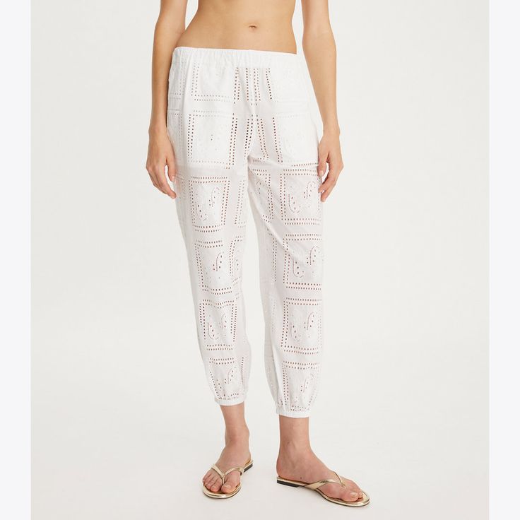 A warm-weather favorite, updated with cotton eyelet. Comfortable and lightweight, our beach pant has a pull-on waist and pockets for added convenience. It packs up easily and is perfect for wearing over a swimsuit. Cotton Bottoms With Elastic Waistband For Warm Weather, Cotton Beach Bottoms For Warm Weather, Cotton Bottoms With Pockets For Vacation, Cotton Bottoms For Beach In Warm Weather, White Cotton Summer Bottoms, Cotton Bottoms For Beach And Warm Weather, White Cotton Bottoms For Warm Weather, Relaxed Fit Cotton Bottoms For Vacation, White Summer Bottoms For Resort Season