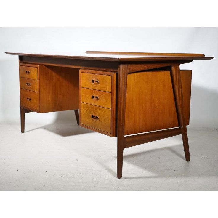 a wooden desk with three drawers on one side and an open drawer on the other