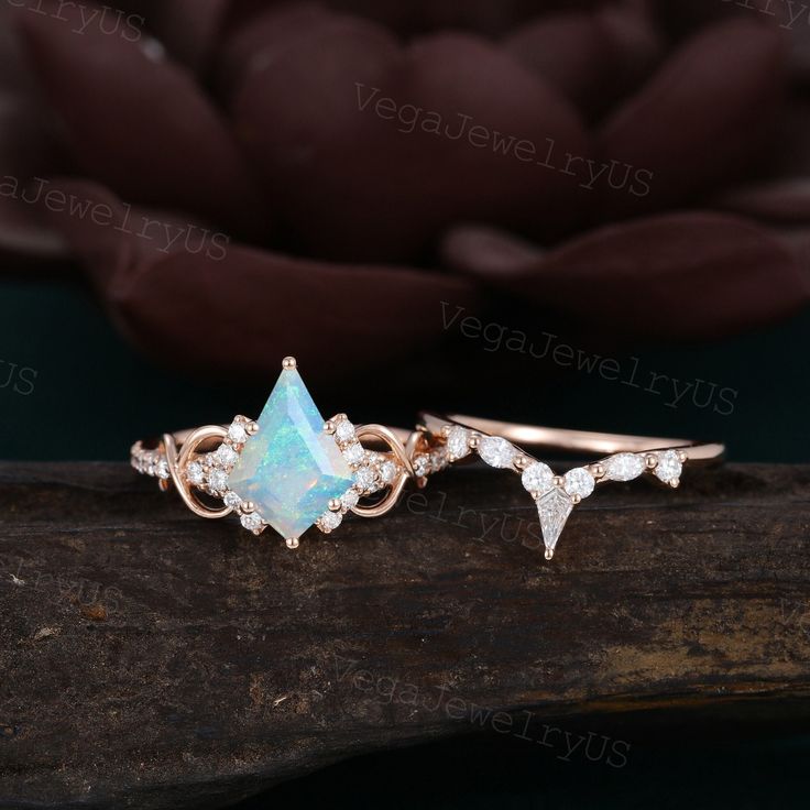 Kite shaped Opal Engagement ring set Unique Rose gold Moissanite ring set Art deco diamond bridal set Antique promise ring Anniversary ring ● Engagement Ring information: --main stone: Lab opal --stone size & shaped: 7*10mm & Kite cut --side stones: Moissanite or Diamond or CZ --side stone weight: 0.22ct ● Wedding Band information: --stone: Moissanite or Diamond or CZ --stone weight & shape: 0.22ct & Round/Marquise/Kite ● Optional service: --personalized order --rush order & overnight --installm Opal Engagement Ring Set Silver, Opal Ring Set, Art Deco Cubic Zirconia Wedding Ring, Opal Ring With Rose Cut Diamonds For Wedding, Wedding Diamond Ring Gemstone, Wedding Opal Ring With Rose Cut Diamonds, Art Deco Moissanite Jewelry For Wedding, Art Deco Moissanite Diamond Wedding Ring, Art Deco Moissanite Wedding Jewelry