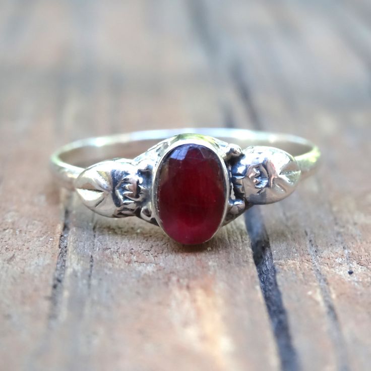 Handmade, Natural Raw (untreated) Ruby Sterling Silver Botanical Ring Featured in this listing are Sterling Silver, handmade, natural stone rings. These lovely ring feature a beautiful, Natural untreated Ruby oval 6x4(approx.) stones. All hand set into .925 Sterling Silver. Please note that there will be natural inclusions, as this ring is untreated, and in it's purest form. There are slight color difference due to nature of each unique stone. Detailed leaf design along each side of the stone, w Natural Stone Rings, Botanical Ring, Star Ruby Ring, Silver Ruby Ring, Raw Ruby, Ring Ruby, Natural Stone Jewelry, Ruby Stone, Be Natural