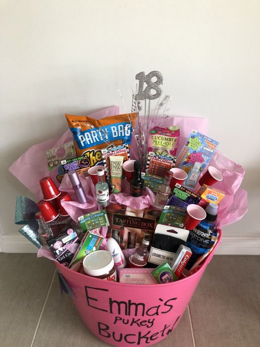 a pink bucket filled with lots of different items