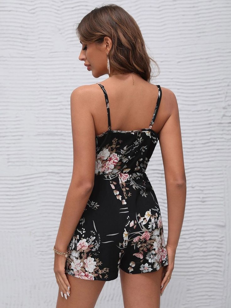 This bohemian-inspired Surplice Neck Floral Sleeveless Cami Romper makes a chic statement with its wrap-style silhouette and luxurious woven fabric. Highlighting a delicate spaghetti strap neckline, this timeless piece boasts a unique combination of style and comfort for a one-of-a-kind look. Perfect for a summer gathering, this cami romper brings effortless sophistication to any ensemble. Specifications: Style: Boho Pattern Type: Floral Type: Cami Details: Wrap Length: Short Fit Type: Regular F Comfy Jumpsuits, Cami Romper, Floral Type, Summer Gathering, Clean Body, Boho Patterns, Black Romper, Floral Sleeveless, Style Boho