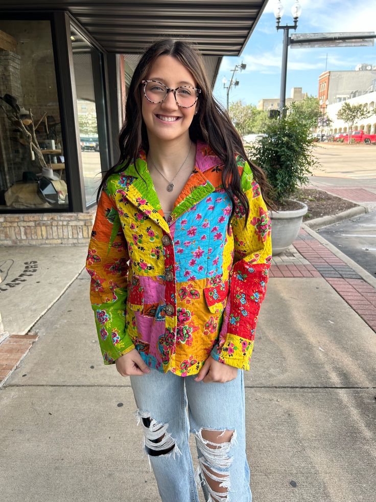 Add a pop of color to your wardrobe with our Kantha Stich Patchwork Blazer! This quirky blazer features a vibrant floral patchwork design, faux pockets, and button closure. Its quilted construction provides both style and warmth. A playful and unique addition to any outfit! Casual Multicolor Outerwear With Floral Patchwork, Multicolor Quilted Spring Outerwear, Spring Multicolor Outerwear With Patch Pockets, Multicolor Cotton Button-up Outerwear, Casual Multicolor Blazer With Pockets, Spring Multicolor Floral Patchwork Outerwear, Fall Multicolor Floral Patchwork Outerwear, Multicolor Cotton Outerwear With Floral Print, Spring Multicolor Cotton Blazer