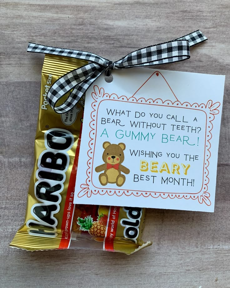 a candy bar with a bear on it next to a note that says what do you call a bear without teeth? a gummy bear wishing you the best month