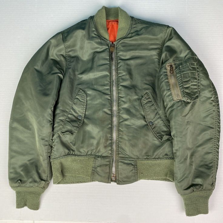 Military Flyer's Men Size 34 Jacket Green Intermediate MA-1 Nylon 1018-695-1620 Nylon Sport Coat For Fall Streetwear, Urban Nylon Outerwear In Khaki, Khaki Nylon Outerwear For Streetwear, Green Outerwear With Zip Fly For Outdoor, Military Style Solid Color Windbreaker For Fall, Military Style Windbreaker For Fall, Urban Nylon Khaki Outerwear, Green Zip Fly Outerwear For Outdoor, Nylon Techwear Outerwear With Zip Fly