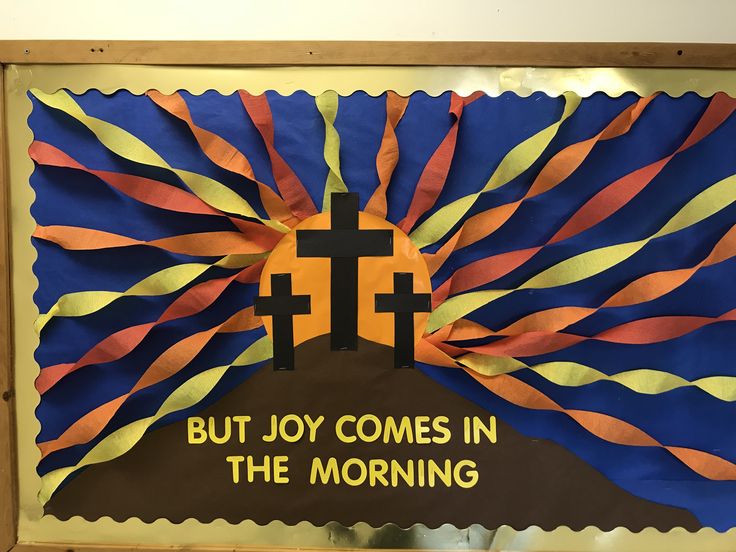 a bulletin board with the words, but joy comes in the morning and a cross on it