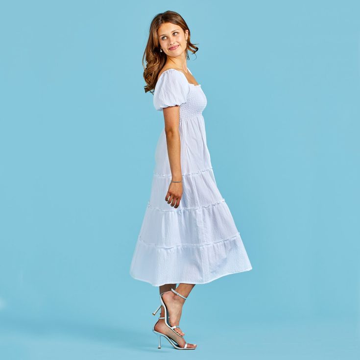 The empire waist of our Sarah dress has a slimming and lengthening effect that looks great on everyone. A romantic silhouette, wear it to remind you of the queen you are. It is comfortable, playful, and stylish all at once. Daywear Maxi Dress With Ruched Bodice And Empire Waist, White Dress With Smocked Bodice And Straight Neckline, Empire Waist Maxi Dress With Fitted Bodice For Daywear, White Maxi Dress With Ruched Bodice And Empire Waist, Casual Midi Dress With Ruched Bodice And Empire Waist, White Feminine Empire Waist Midi Dress, Feminine Empire Waist Maxi Dress, Casual Dress With Fitted Bodice And Straight Neckline, Casual Empire Waist Dress With Fitted Bodice