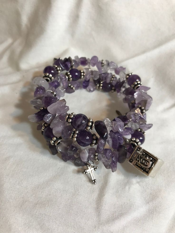 "The Amethyst Crystal Stone has healing properties are connected to your headspace, and work to sooth your mind of any worries, stress, or tension. This bracelet unwrapped approximate length is 26\" inches. It is a replacement for the stretchy bracelets I previously made as you get more bracelet now for the money, and don't have to worry about breakage. The Memory Wire Wrapped Prayer Box Bracelet consist of Amethyst Chip Beads that are separated at points with Sterling Silver Spacer Beads, 8mm Round Amethyst Stone Beads, the round beads are capped with Sterling Silver Daisy Bead Caps, the main charm is a drop antique silver-finished pewter (zinc-based alloy) 15x10mm cube prayer box with swirl design and magnetic safety latch with lobster claw clasp. The prayer box actually opens to store m Adjustable Spiritual Purple Stretch Bracelet, Adjustable Natural Stones Rosary Bracelet For Meditation, Adjustable Rosary Bracelet With Natural Stones For Meditation, Adjustable Rosary Bracelet For Healing With 108 Beads, Spiritual Rosary Bracelet With Natural Stones For Meditation, Spiritual Lavender Crystal Bracelet For Meditation, Adjustable Wrap Bracelet With Gemstones For Meditation, Amethyst Beaded Bracelet For Meditation, Lavender 8mm Beads Jewelry For Healing