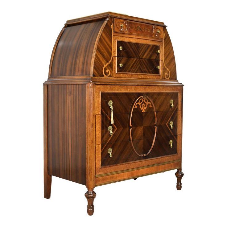 an old fashioned wooden cabinet with carvings on the front and sides, inlaid to wood veneers