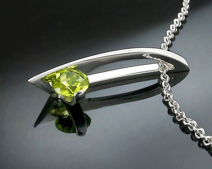 "Peridot Necklace - Argentium Silver - 3458 - Argentium Chain Included Modern and contemporary, this pendant makes a high fashion statement. ( IMPORTANT - PLEASE READ 1. AND 2 BELOW ) 1.) INCLUDED IN THE PRICE IS AN ARGENTIUM SILVER CHAIN APPROPRIATE FOR THE PENDANT CHOSEN. YOU CAN CHOOSE FROM 16\", 18\" OR 20\" LENGTH AT CHECKOUT. 2.) PLEASE LOOK AT THE MEASUREMENTS CAREFULLY. SOME PHOTOS HAVE BEEN ENLARGED TO SHOW DETAIL, WHILE OTHERS HAVE BEEN MINIMIZED TO FIT THE FRAME. ACTUAL SIZE CANNOT BE Modern Peridot Jewelry For Formal Occasions, Modern Green Necklace With Polished Finish, Modern Peridot Jewelry As A Gift, Modern Peridot Jewelry For Gift, Modern Green Peridot Jewelry, Modern Silver Jewelry For May Birthstone, Contemporary Green Sterling Silver Jewelry, Modern Silver Jewelry With Peridot, Modern Silver Peridot Jewelry