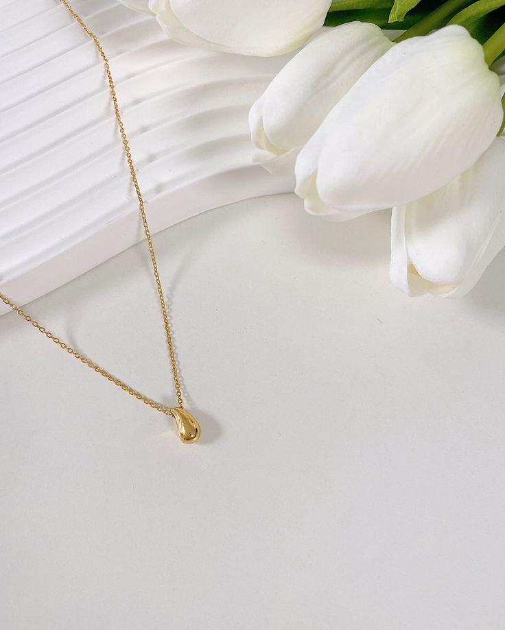 In a world where emotions run deep and beauty is found in the delicate balance of strength and vulnerability, the "Teardrop" Necklace tells a story of resilience. Like a tear that falls but never breaks, this 18k Gold Vermeil pendant glows with quiet defiance, a symbol of the bittersweet moments we carry with us. It’s more than just jewelry—it’s a reminder that even in the softness, there’s strength. Teardrop Charm: 8mm x 11mm, a small yet powerful emblem of grace under pressure. Chain Length: 1 Luxury Everyday Teardrop Pendant Jewelry, Tarnish Resistant Teardrop Pendant Charm Necklace In Yellow Gold, Minimalist Yellow Gold Teardrop Pendant Charm Necklace, Delicate Teardrop Yellow Gold Charm Necklace, Delicate Yellow Gold Teardrop Charm Necklace, Everyday Yellow Gold Teardrop Necklace, Delicate Yellow Gold Teardrop Pendant Charm Necklace, Tarnish Resistant Teardrop Yellow Gold Drop Necklace, Tarnish Resistant Yellow Gold Drop Necklace