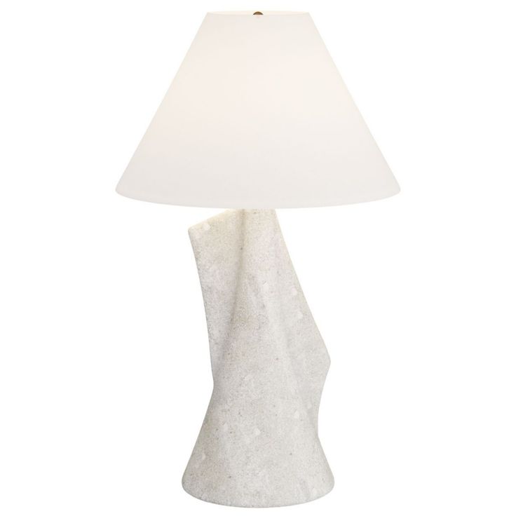 a table lamp with a white shade on it's base and a light bulb in the middle