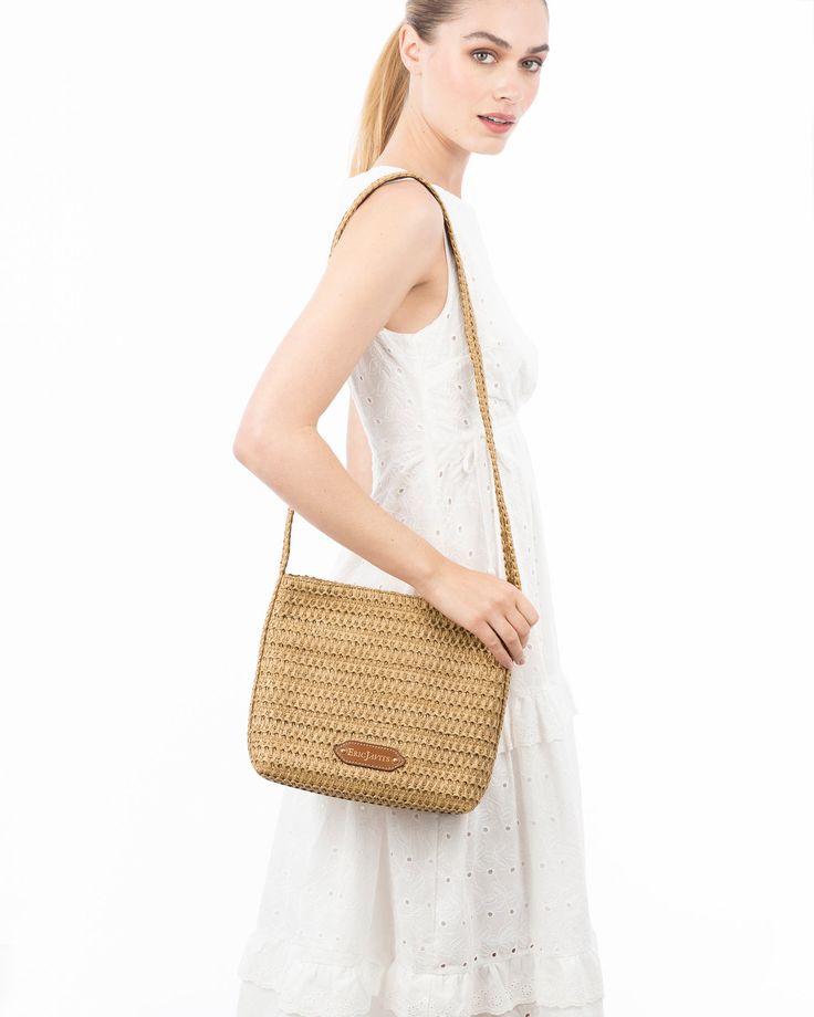 A women's designer crossbody bag for sale online of woven raffia with top zipper closure is super cute for use throughout spring-summer months. The textured weave is intricate with its long strap extending down the sides of the bag body. The mid-size rectangular shape is soft and squishy and feels body friendly. A roomy outer pocket on reverse is for easy access to phone or glasses. Inside: durable cotton canvas lining, sidewall zipper compartment and roomy patch pocket. Dimensions: Front and ba Designer Crossbody Bag, Closure Weave, Gold Sand, Woven Raffia, Natural Gold, Designer Crossbody, Designer Crossbody Bags, Mid Size, Summer Months