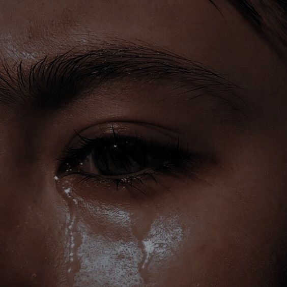 a close up of a person's eye with snow all over the upper part of it