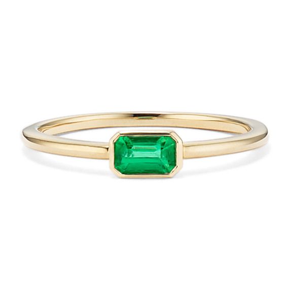 A natural emerald is the star of this beautiful bezel-set ring. A classic emerald cut showcases the emerald’s vibrant green color  while warm 14-karat yellow gold makes the perfect complement. Wear this ring alone  or stack it with favorites. To care for natural emeralds  gently clean with mild soapy water and a soft cloth. Avoid harsh chemicals  ultrasonic jewelry cleaners  and extreme temperature changes. Green Emerald Ring With Bezel Setting, Bezel Set Baguette Cut Emerald Ring, Emerald Baguette Cut Ring With Bezel Setting, Baguette Cut Emerald Ring With Bezel Setting, Baguette Cut Bezel Set Emerald Ring, Green Emerald Cut Ring With Bezel Setting, 14k Gold Emerald Cut Emerald Ring With Single Diamond, Fine Jewelry Octagon Emerald Ring With Bezel Setting, Emerald Ring With Bezel Setting For May Birthstone