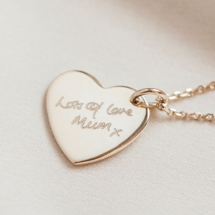 "A handmade heart or circle charm necklace in silver, rose gold or gold personalised with your writing. A unique and stunning gift for any jewellery lover, this personalised bar necklace is simple yet carries so much meaning- the perfect present for birthdays, anniversaries, graduation and more. Available in Sterling silver, Rose gold and Yellow gold Plate (over silver) Text will be scaled to fit. Do contact us if you need any help or advice. * * * How we get your handwriting * * * 1. Once you have placed your order, consider the handwriting you would like to use. Ideally this will be on a clear background. 2. Scan or take a photo of the handwriting in natural light, from directly above, ensuring the lines are clear and there is little to no gradient in the image. 3. Please send us your ha Personalized Gift Necklace With Heart Charm, Meaningful Heart Charm Necklace For Personalized Gift, Minimalist Personalized Heart Pendant Charm Necklace, Meaningful Jewelry With Engraving Option For Valentine's Day, Minimalist Personalized Heart Pendant Charm Necklaces, Dainty Personalized Heart Necklace As A Gift For Her, Minimalist Heart Charm Necklace For Personalized Gift, Minimalist Charm Necklace With Heart Charm For Personalized Gift, Minimalist Rose Gold Name Necklace As Gift For Her