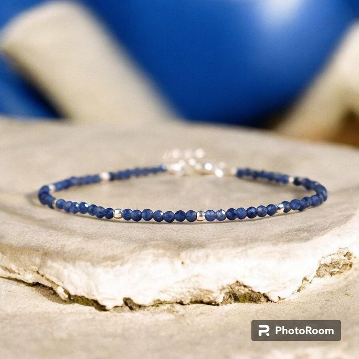 This sapphire bracelet is a stunning accessory that will brighten up your wrist and your mood. It is handmade with high-quality elastic cord and has a comfortable fit. It measures about 6.5 inches in length and can be adjusted to fit most wrists. The bracelet is easy to wear and take off. This bracelet is perfect for anyone who loves boho chic style, natural stones. It is a unique and meaningful gift for yourself or someone special. You can wear it alone or stack it with other bracelets for a layered look. - Made to Order - Material : Natural Sapphire - Bracelet Length: fit for 6 ~ 7.5 inches wrist, adjustable - Hand Woven Bracelet with Love and Sincerity - Due to different light and screen, the color may be slightly different from the picture. - Every natural stone is measured by hand, th Dainty Blue Stackable Bracelets, Minimalist Blue Hypoallergenic Bracelets, Adjustable Faceted Sapphire Bracelets, Adjustable Faceted Sapphire Bracelet, Blue Gemstone Beads Minimalist Bracelets, Dainty Blue Bracelets With Natural Stones, Minimalist Blue Gemstone Bead Bracelets, Dainty Blue Gemstone Beaded Bracelets, Blue Dainty Gemstone Beaded Bracelet