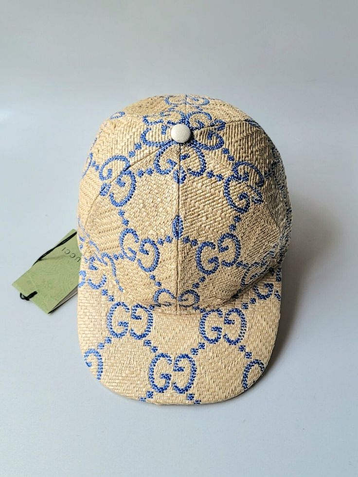 Unisex Baseball Cap in natural-colored Santa Barbara Raffia Chevron with large Gucci GG logo print in blue. Adjustable closure on the back in off-white leather. Model: 701713 Color: Sand/White/Blue Size: M, 57 cm, very comfortable fit. Made in Italy. Brand new with tags attached and dustbag. Retail $610. 100% authentic or your money back. Gucci Short Brim Summer Hats, Luxury Gucci Summer Hat, Designer Visor Hats For Spring, Designer Flat Brim Hats For Spring, Casual Gucci Hat With Curved Brim, Gucci Casual Baseball Cap With Curved Brim, Gucci Adjustable Flat Brim Hat, Casual Gucci Baseball Cap With Curved Brim, Luxury Gucci Baseball Cap