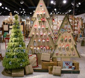 three christmas trees are on display in a store