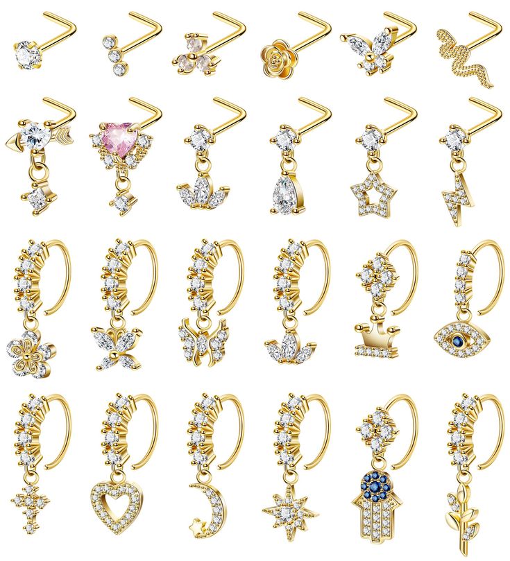 various types of ear rings with different designs and colors on them, all in gold