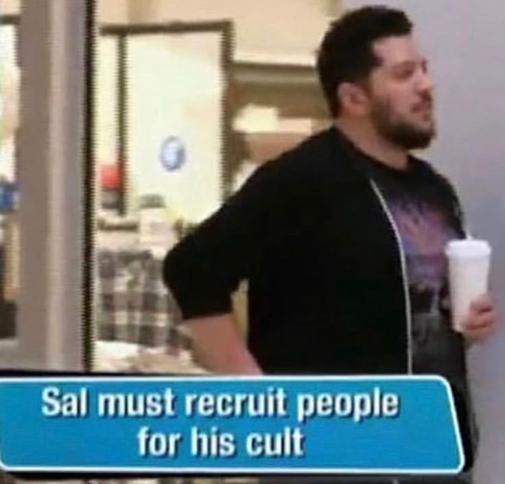 a man holding a cup and standing next to a sign that says sal must recruit people for his cut