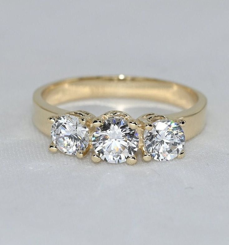 💙 14k solid gold three stone ring with D Color (colorless) moissanite gemstones as the best alternative for natural diamonds. 💙 Unique design ring for engagement, wedding, anniversary and milestones. 💙 Handcrafted with love and great care at San Francisco Bay! 💙 The ring material is 14k solid gold, should not be confused with gold plating or filling. It won't tarnish or fade over time. 💙 We're offering the finest quality and we gladly accept returns if you find our items less than perfect a Alexandrite Jewelry, Handmade Fine Jewelry, Three Stone Ring, Three Stone Engagement, Ruby Jewelry, Stone Engagement, Emerald Jewelry, Jewelry For Her, Ring Unique