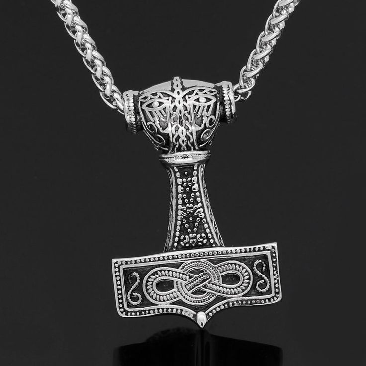 The bearer of this necklace will hold the most powerful weapon ever existed, Mjölnir. Forged by the great dwarves smiths in Nidavellir. This precious necklace symbolizes the strength of Thor, god of thunder and son of Odin. Thor’s power is immanent in this fine stainless steel necklace that was carefully crafted to perfection. Live like the gods, be a god! Carefully packaged Made to order and for worldwide shipping + tracking number Metal: 100% Stainless Steel Chain length: 60 cm / 24 inches Black Viking Engraved Jewelry, Viking Style Engraved Jewelry For Larp, Viking Pendant Necklace Collectible, Viking Style Pendant Necklace Collectible, Black Viking Metal Jewelry, Collectible Viking Pendant Necklace, Thor God Of Thunder, Thor Mjolnir, Thor God