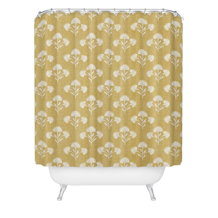 a yellow shower curtain with white flowers on the front and bottom, against a white background