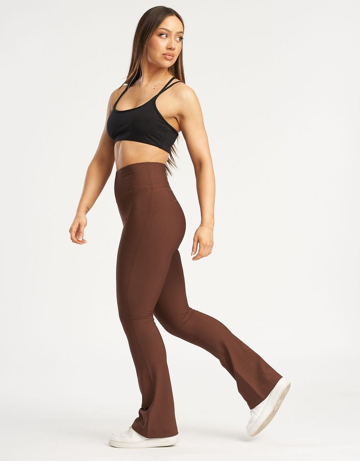 The Flare Waffle Pants are an iteration of the ever popular Flare Leggings with a new waffle pattern fabric. With a perfected length, width and comfort plus the super soft feel of the waffle fabric offers everything you need in a street-to-gym yoga pant - High Waisted: To keep you feeling secure - Flexible Waistband: Designed to lie flat on your skin - Additional Rear Zip Pocket - Super comfy ribbed fabrication - Designed for high movement activities, as well as leisure 81% Nylon, 19% Spandex Be Waffle Pants, Feeling Secure, The Flare, Movement Activities, Waffle Fabric, Yoga Pant, Chestnut Brown, Gym Yoga, Flare Leggings