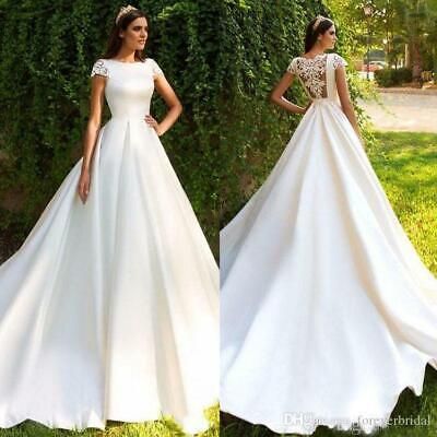 two different views of a woman in a white wedding dress, one wearing an open back gown