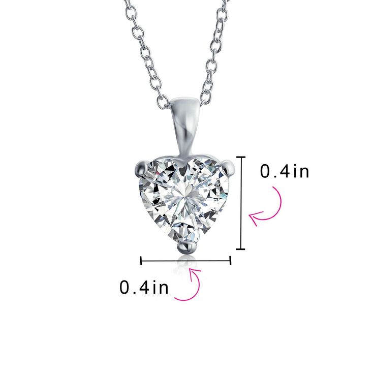 Enhance your wedding day look with this evocative and exquisite .925 Sterling Silver Cubic Zirconia heart necklace. Crafted with both durability and allure in mind, this solitaire heart pendant necklace is made of high-quality .925 Sterling Silver. The 4 Carat Cubic Zirconia stone is guaranteed to leave a lasting impression every time you wear it. Don't miss out on this marvelous piece - order yours today. Bridal Pendant Necklace, Bridal Pendant, Bridemaids Gifts, Cubic Zirconia Jewelry, Solitaire Necklaces, Wedding Bridal Jewellery, Cz Pendant, Solitaire Pendant, Engraved Items