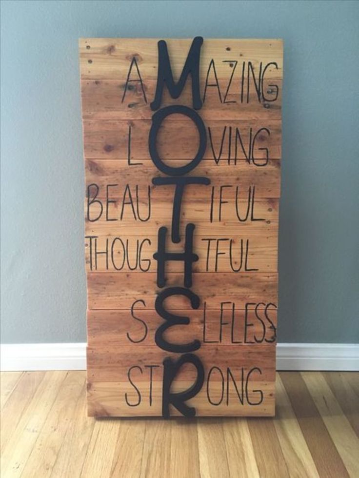 a wooden sign with words on it that read, amazing moming is loving beautiful though difficult so she's strong and strong