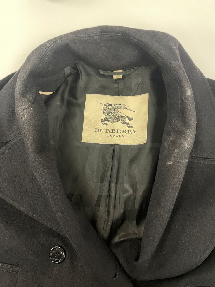 Sourced in CanadaMeasurementsSize: SPit to Pit: 21" Arm: 26"Length: 29.5" Condition: Visible staining on collar, front left pocket, left sleeveMaterial Composition: Main Fabric- 80% wool, 20% cashmere, Main Lining - 50% acetate, 50% viscoseColour: Black Designer Wool Coat With Hidden Buttons, Designer Wool Coat With Hidden Button Closure, Designer Single Breasted Wool Coat, Designer Single-breasted Wool Coat, Designer Long Sleeve Pea Coat With Button Closure, Designer Long Sleeve Pea Coat With Concealed Placket, Designer Long Sleeve Wool Coat For Office, Designer Long Sleeve Pea Coat For Winter, Designer Pea Coat With Concealed Placket For Fall