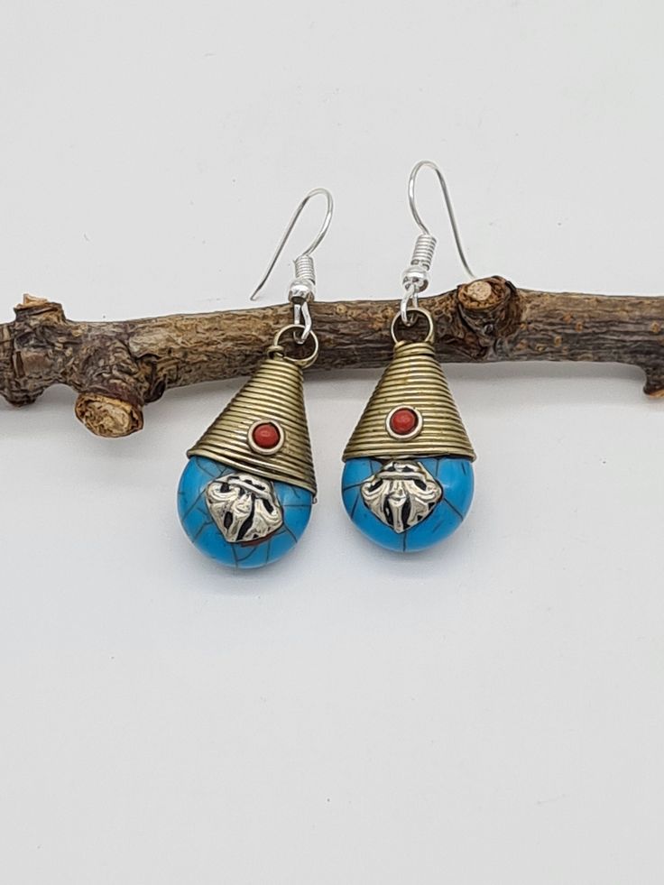 These are elegant Tibetan blue teardrop earrings from Nepal.  Each pair has been handcrafted with Tibetan beads made from resin. Earrings are very lightweight ( 3.7 g each) Earrings come with a pretty pouch.  *We have various colours and styles - Please check our listings *All our jewellery are handmade, hence imperfections might be present, however it makes each item truly unique. *Delivery: parcel is sent with a standard delivery. No tracking number is provided. Yoga Earrings, Statement Jewellery, Resin Earrings, Style Gift, Estonia, How To Make Beads, Teardrop Earrings, Gift For Women, Statement Jewelry