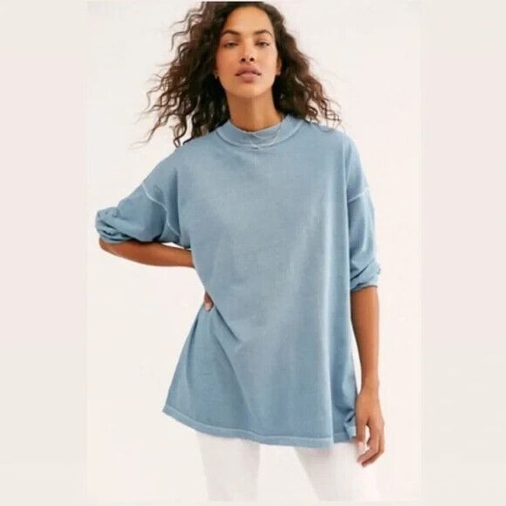 Elevate Your Wardrobe With This Stylish Free People Mock Neck T-Shirt In Blue. This Versatile Piece Features Long Sleeves And A Solid Pattern, Making It Perfect For Any Occasion. The Shirt Is Made From High-Quality Materials And Designed With A Regular Size Type For A Comfortable Fit. The Mock Neck Adds A Touch Of Sophistication To The Basic Style, And The Xs Size Ensures A Flattering Fit For Petite Frames. Whether You're Dressing Up For A Night Out Or Keeping It Casual, This Free People T-Shirt Light Wash Soft-washed Cotton Tops, Casual Soft-washed Washed Blue Tops, Casual Washed Blue Soft-washed Tops, Blue Cotton T-shirt For Layering, Soft-washed Washed Blue Tops For Loungewear, Blue Relaxed Fit T-shirt, Everyday Soft-washed Washed Blue Tops, Trendy Soft-washed Washed Blue Top, Trendy Washed Blue Soft-washed Tops