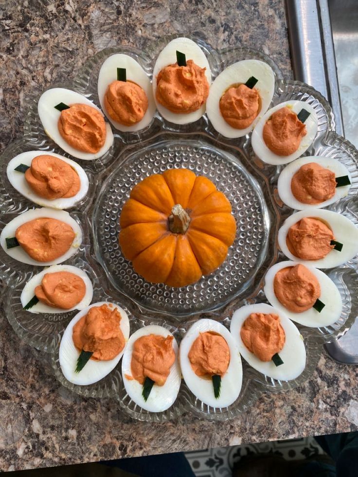 deviled eggs are arranged in the shape of a pumpkin