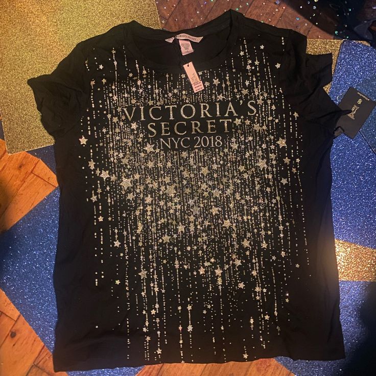 Rare And Worthy Of A Quick Covet. $ Mildly Firm & May I Kindly Request You To Initiate An Offer. Length Is At 22 And Pit-2-Pit Is At 18. Crew Neck T-shirt With Letter Print For Night Out, Victoria's Secret Crew Neck T-shirt, Black Short Sleeve Tops With Star Print, Black Cotton T-shirt With Glitter Print, Trendy Victoria's Secret Crew Neck Top, Graphic Tee With Letter Print For Night Out, Trendy Black T-shirt With Glitter Print, Victoria's Secret Crew Neck Top With Letter Print, Victoria's Secret Graphic Print T-shirt