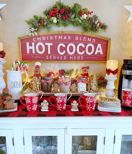 a christmas themed buffet with hot cocoa and candy