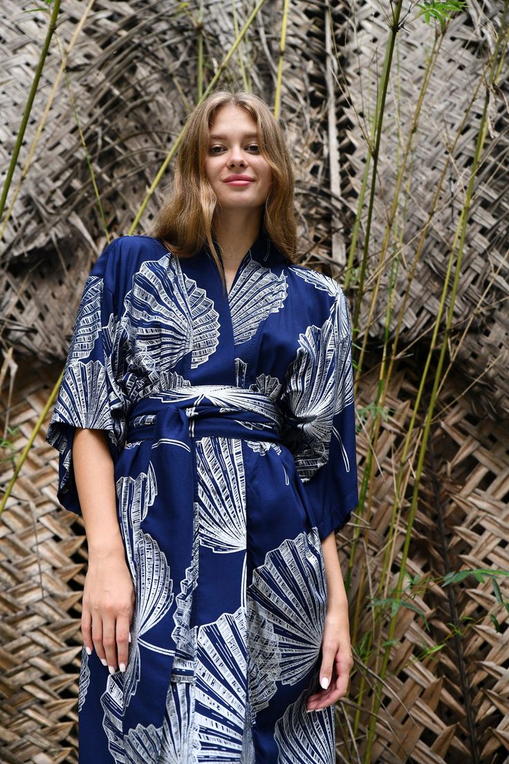 The kimono has a loose swing shape for an easy, flowy fit making it extremely comfortable to wear. The palm leaf  Print covers the entire front and back panel and is piped in a lovely contrast colour. Use the belt included with the dress if you prefer a more fitted look. Our kimono comes in 4 sizes and 3 lengths, Size: *SMALL will fit size UK 8-12 /US 4-8 . Width is 120cm. Will fit up to a bust measurement 92 cm to allow for a 15 cm each side overlap *REGULAR will fit size UK 14-16/US 10-12. Wid Belted Kimono For Beach, Summer Beach Kimono With Belt, Beach Kimono With Belted Kimono Sleeves, Summer Kimono With Belted Kimono Sleeves, Summer Kimono With Belted Waist And Kimono Sleeves, Beach Kimono With Belt, Belted Kimono With Kimono Sleeves For Vacation, Summer V-neck Belted Kimono, Palm Leaves Print