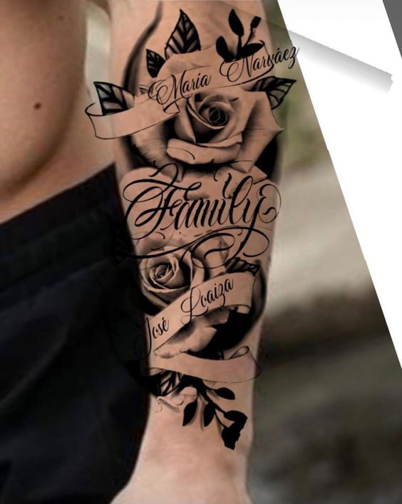 a man with a tattoo on his arm that says family and has roses around it