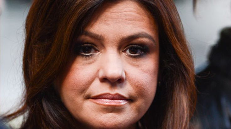 a close up of a woman with brown hair